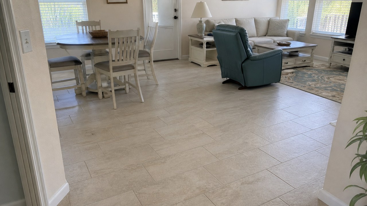 Finished tile floor in a Brevard County living area with clean grout lines and trim